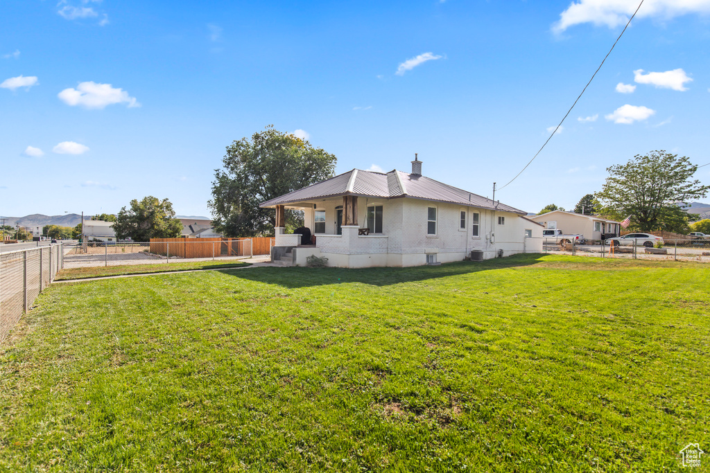 Exterior space featuring a lawn