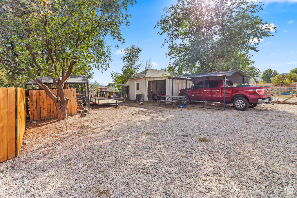 View of yard with a storage unit