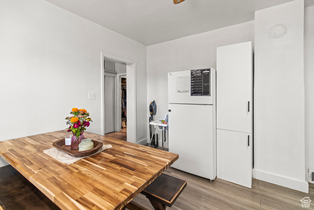 Dining area with hardwood / wood-style floors