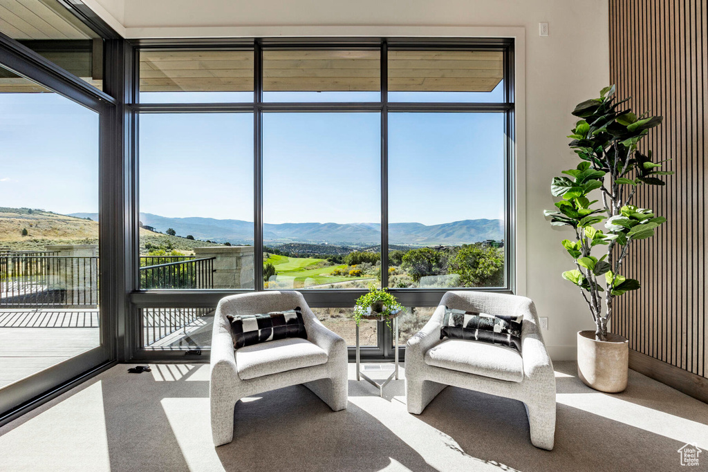 Sunroom with a mountain view