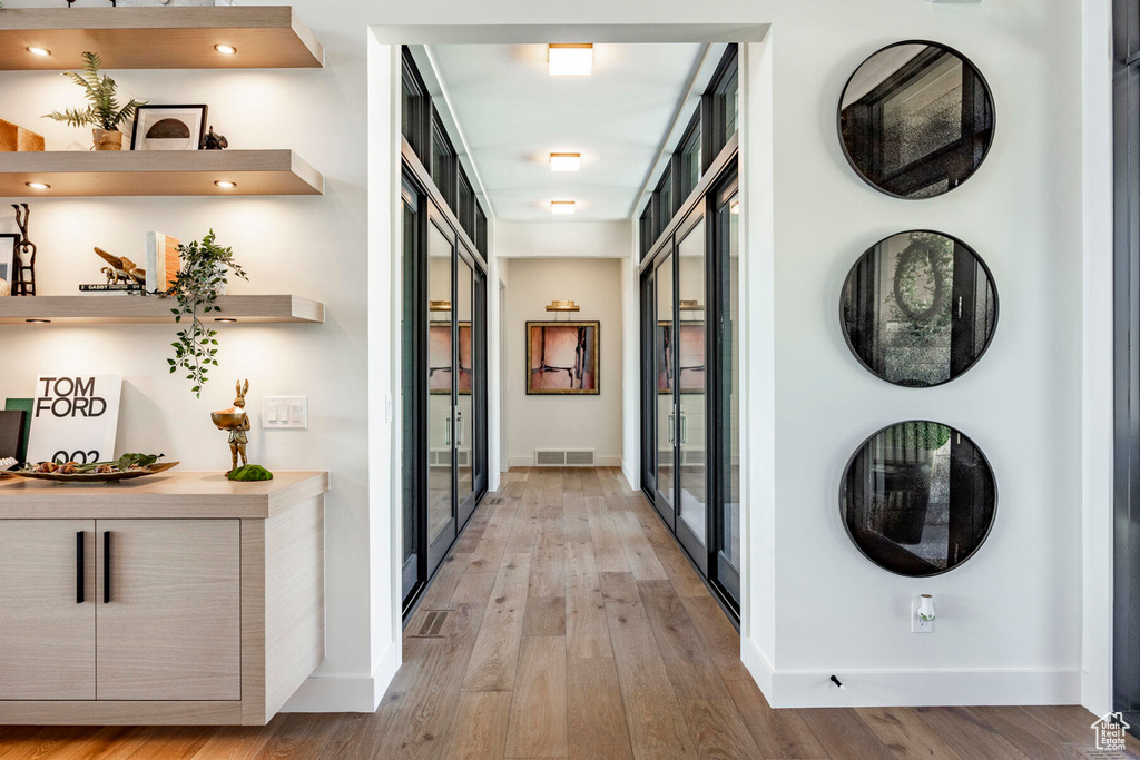 Hall with light wood-type flooring