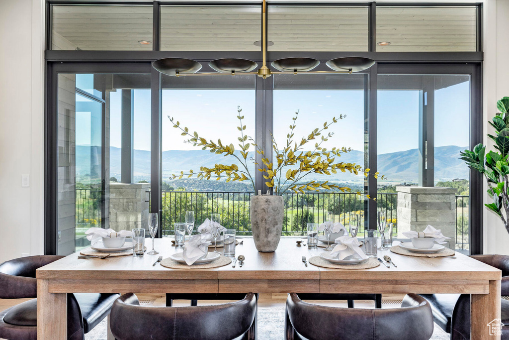 Dining room featuring a wealth of natural light and a mountain view