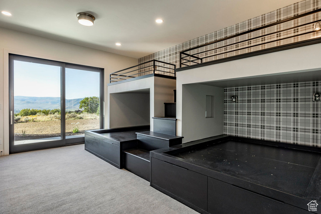 Interior space with a mountain view and carpet