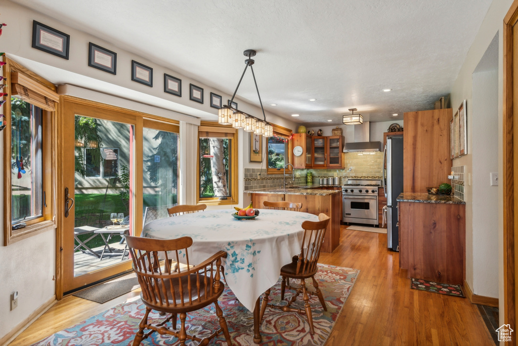 Dining area featuring light hardwood / wood-style flooring and sink