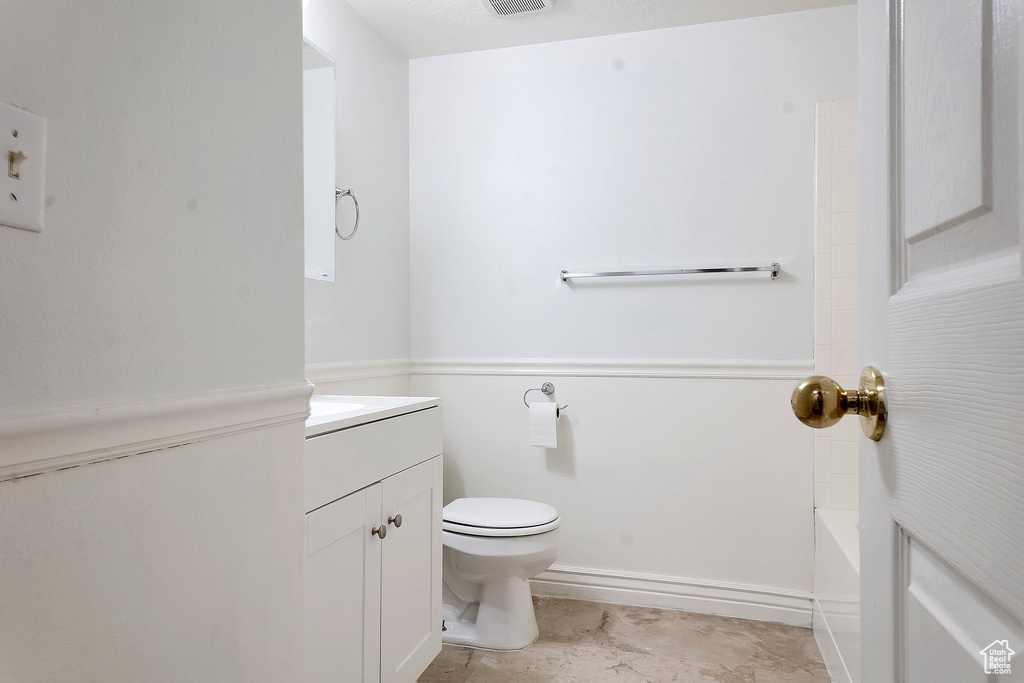 Bathroom with vanity and toilet