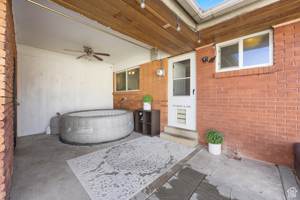 View of patio featuring ceiling fan