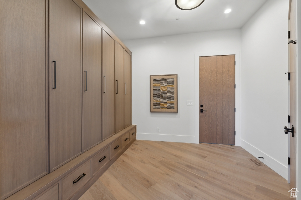 Mudroom with light wood-type flooring