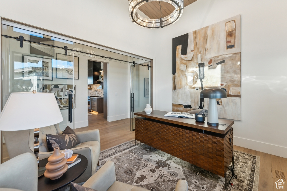 Home office with light wood-type flooring