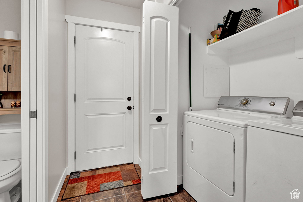 Clothes washing area featuring separate washer and dryer