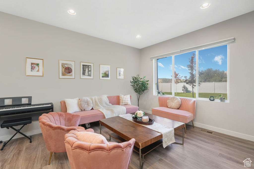 Living room with light wood-type flooring