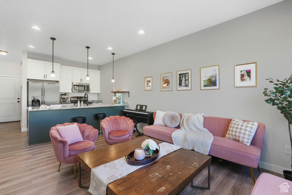 Living room with wood-type flooring