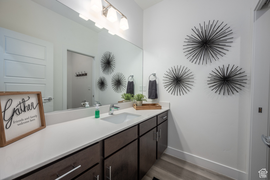 Bathroom featuring wood-type flooring and vanity