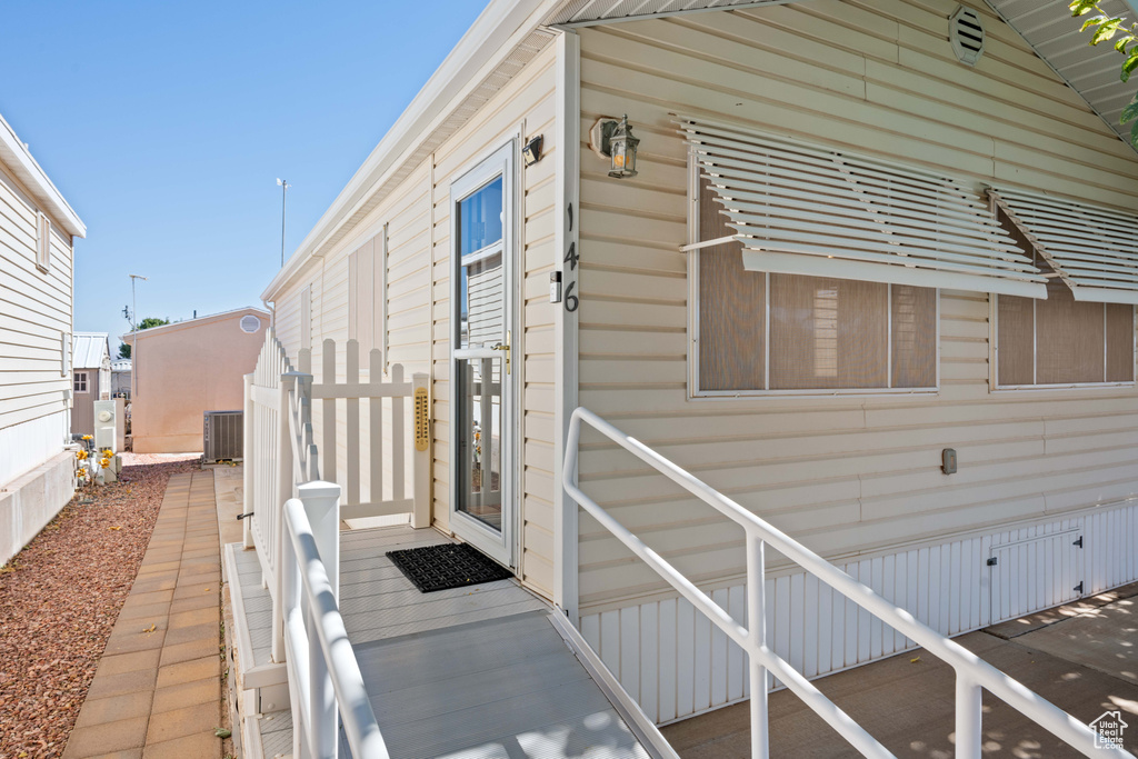 View of side of property with central AC