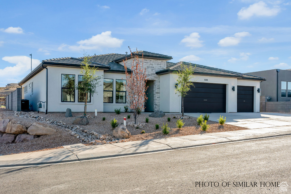 View of front of property with a garage