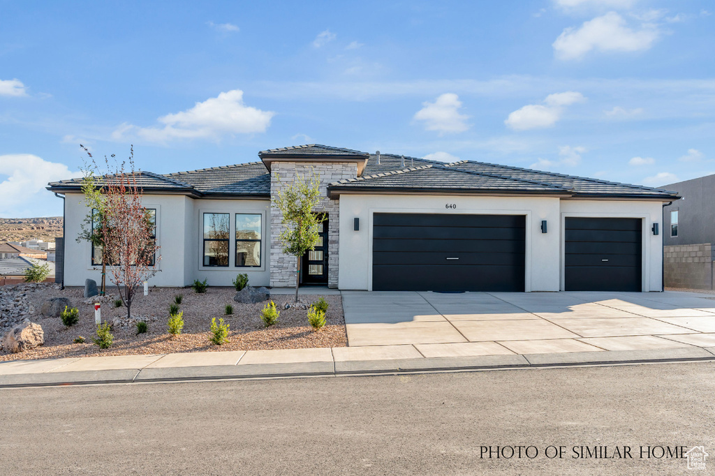 Prairie-style home with a garage