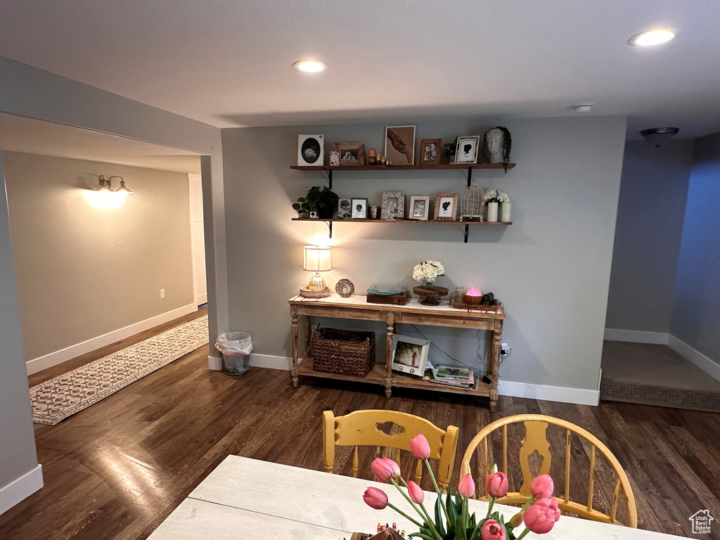 Bar with dark hardwood / wood-style floors