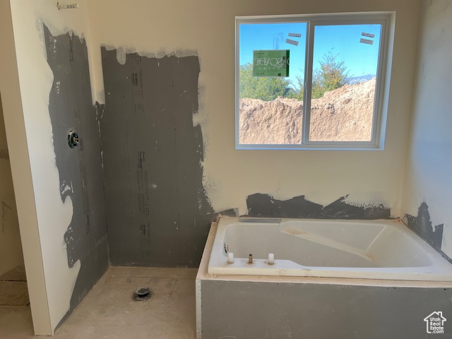 Bathroom with tiled tub