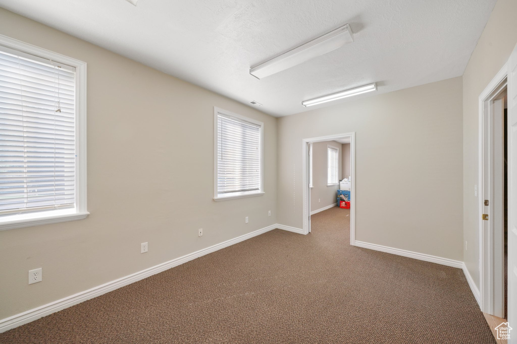 Unfurnished bedroom with carpet