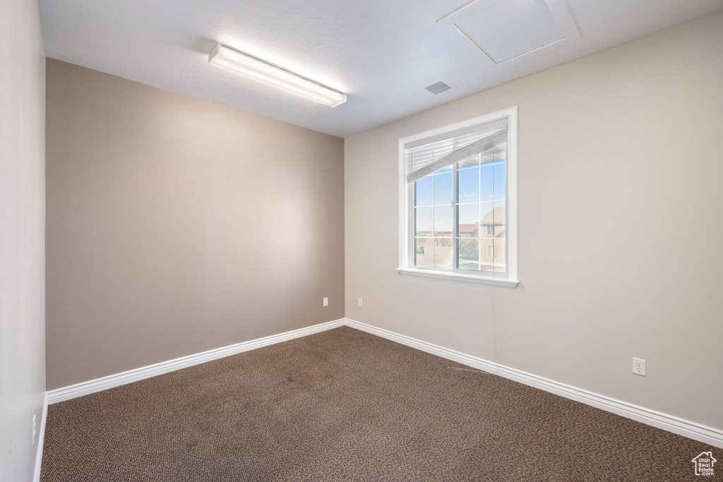 Spare room with carpet floors