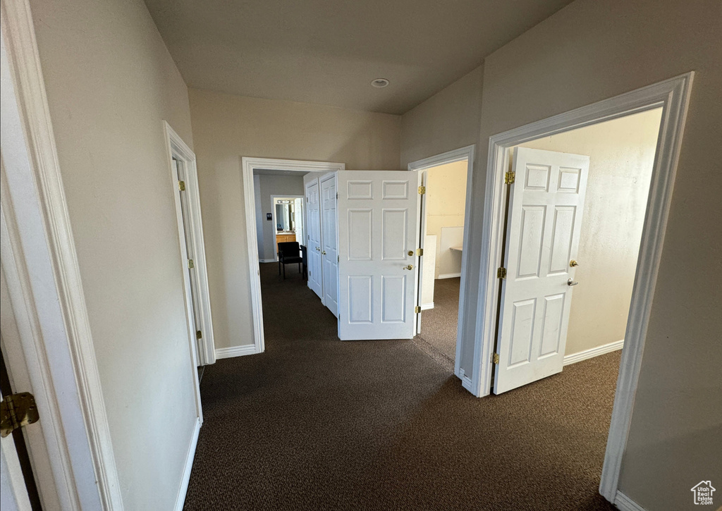 Hallway with dark carpet