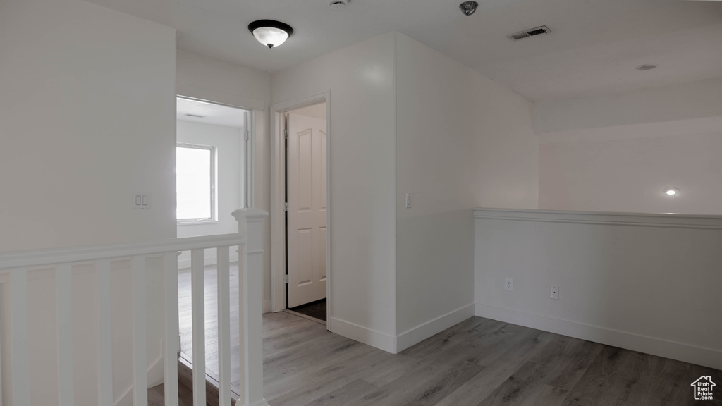 Hallway featuring light hardwood / wood-style flooring