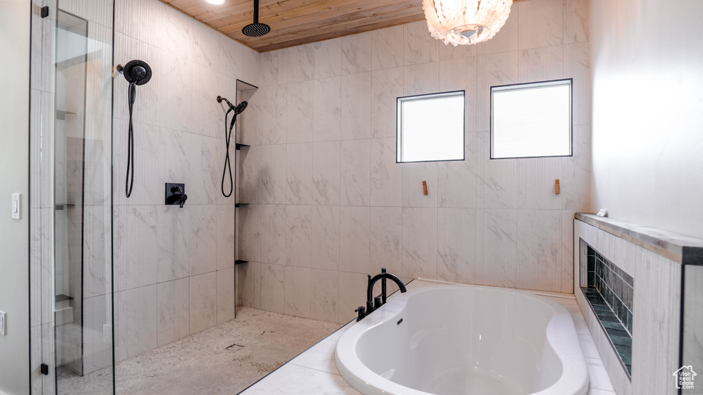 Bathroom with wood ceiling and separate shower and tub