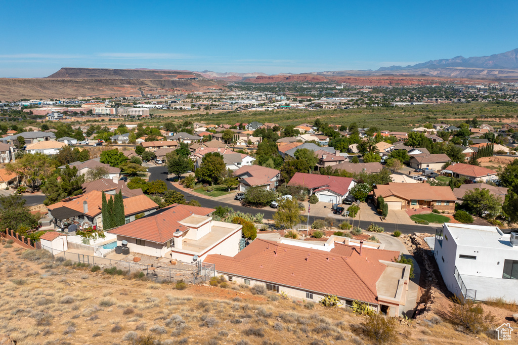 Birds eye view of property with a mountain view