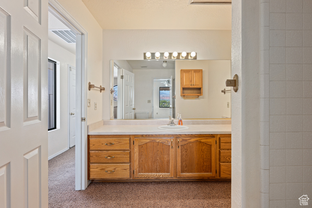 Bathroom with vanity and toilet