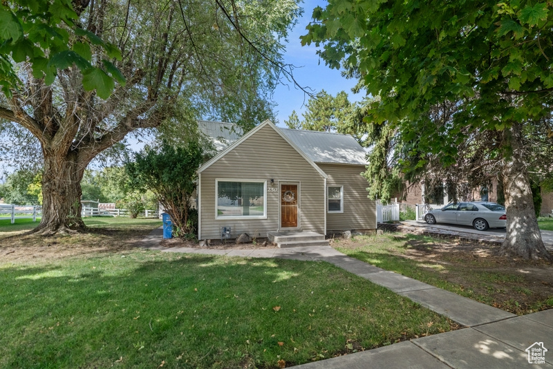 Bungalow-style home featuring a front yard