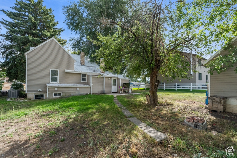 Exterior space featuring central AC unit and a patio