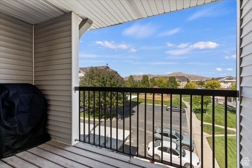 Balcony featuring a mountain view and a grill