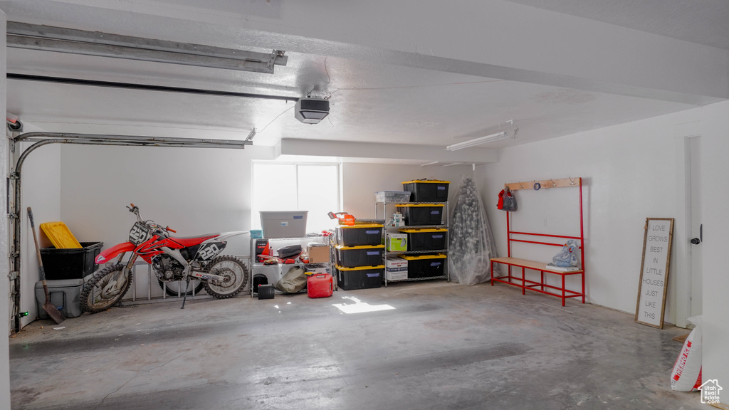 Garage featuring a garage door opener