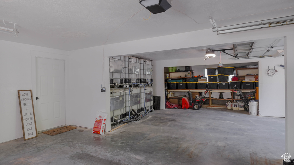 Garage featuring a garage door opener