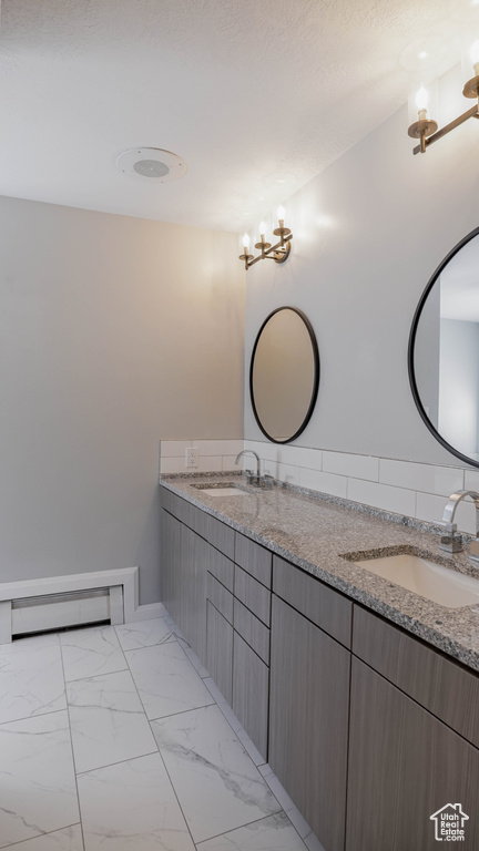 Bathroom with vanity and lofted ceiling