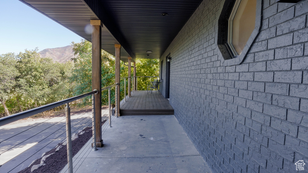 Balcony with a mountain view and covered porch