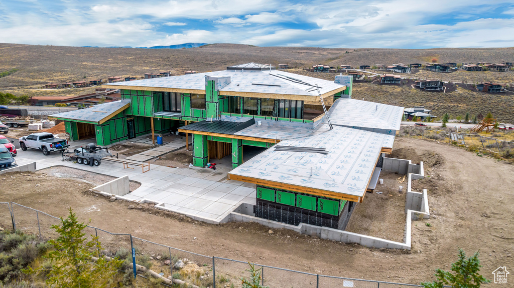 Birds eye view of property with a mountain view