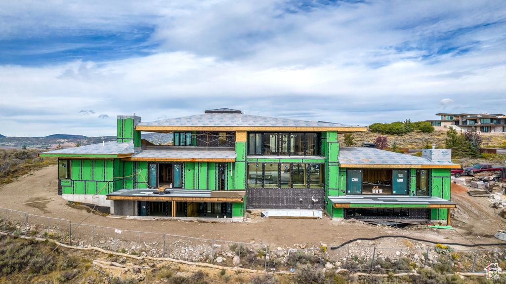 Back of property with a mountain view