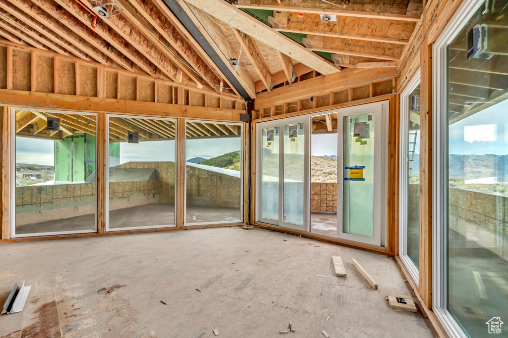 Unfurnished sunroom featuring a wealth of natural light