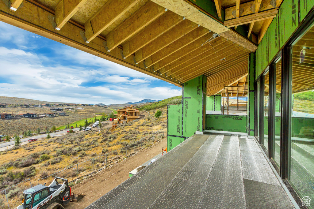 Exterior space featuring a balcony and a mountain view