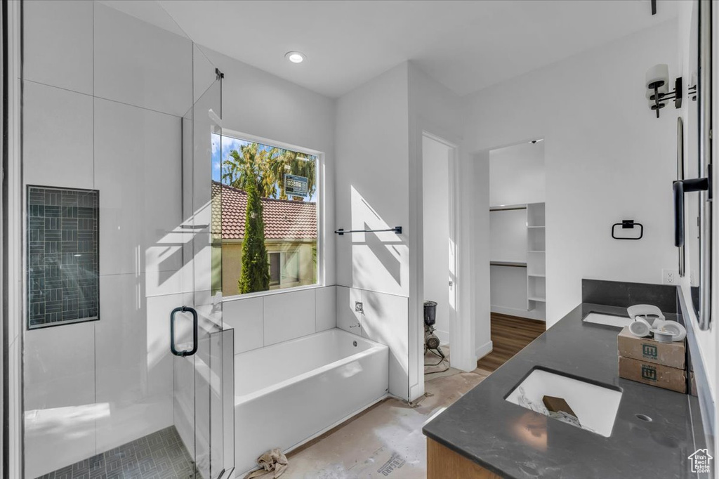 Bathroom with plus walk in shower and vanity