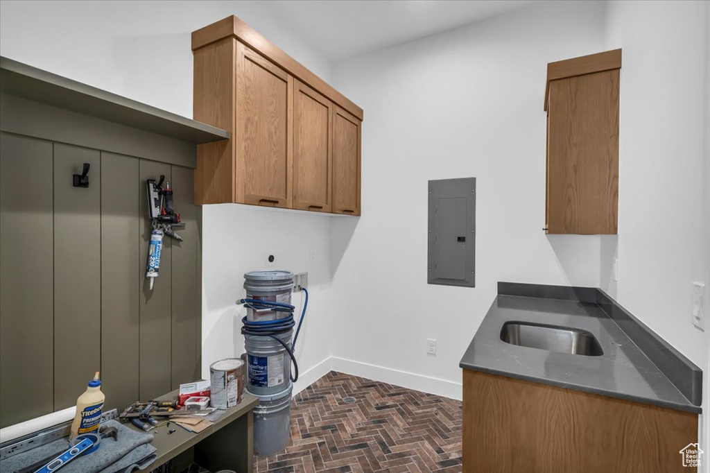 Kitchen with electric panel and sink