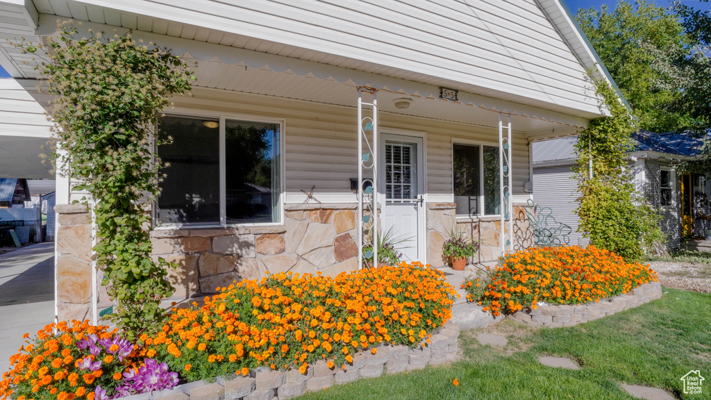 Property entrance with covered porch