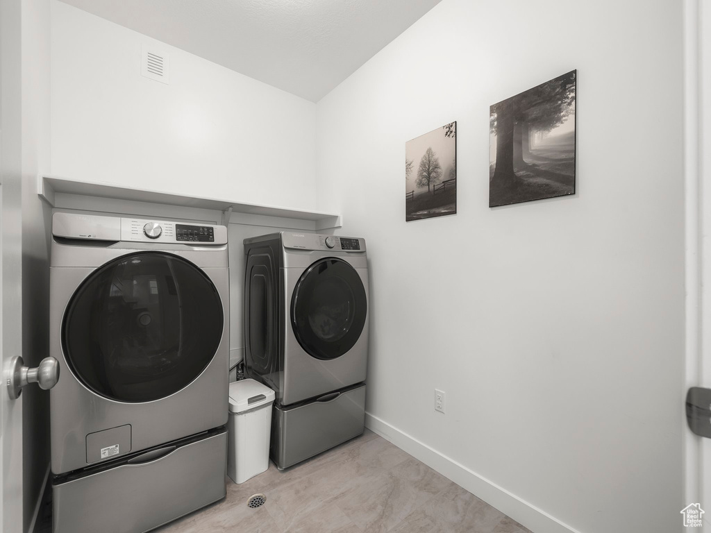 Laundry area with separate washer and dryer