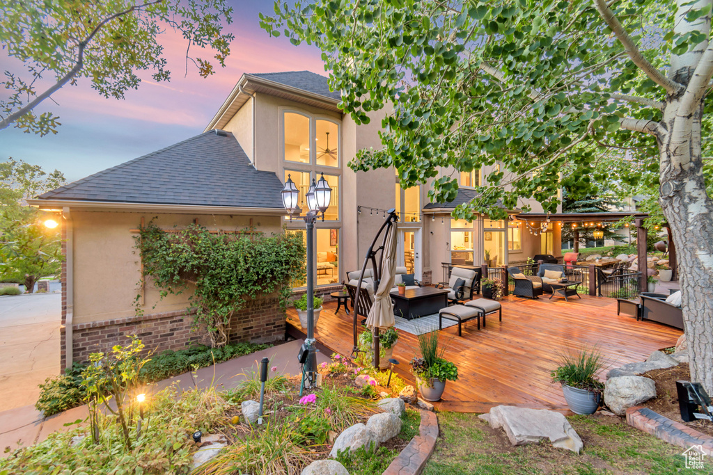 Exterior space with outdoor lounge area and a deck