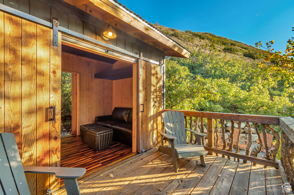 Wooden deck featuring a mountain view