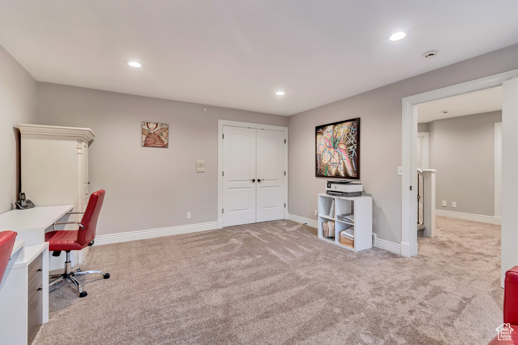 Office featuring light colored carpet