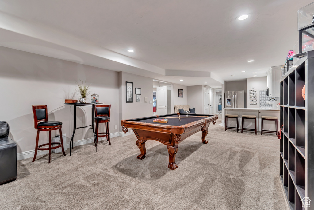 Recreation room with light carpet and pool table