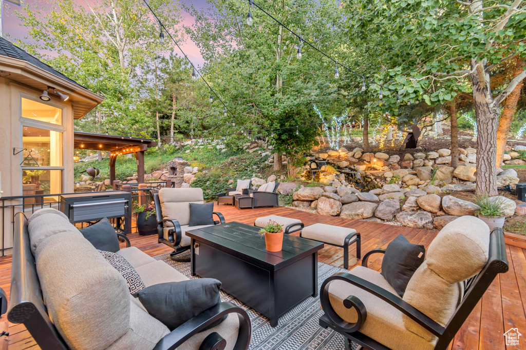 Deck at dusk with outdoor lounge area