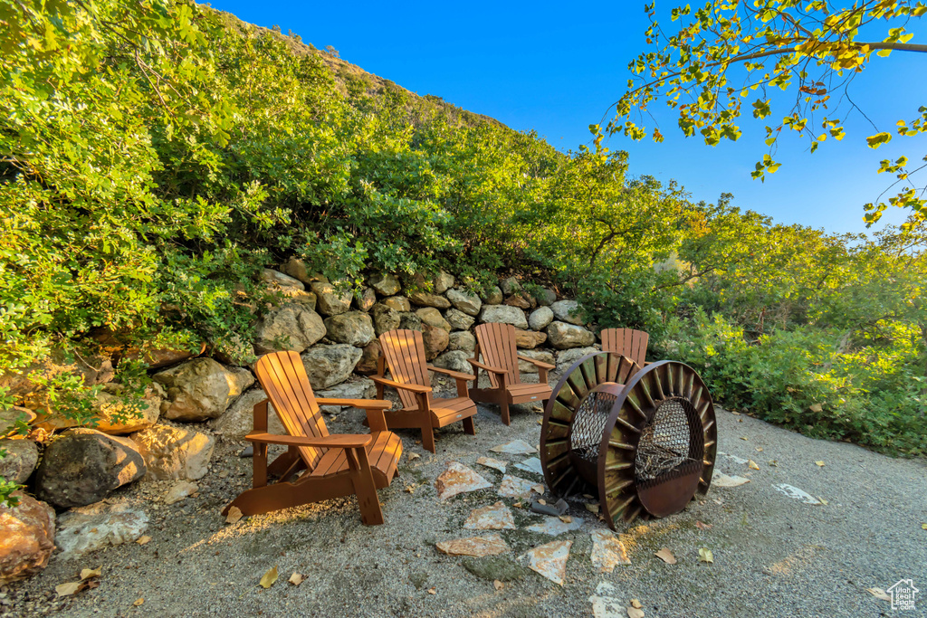 View of patio / terrace with an outdoor fire pit