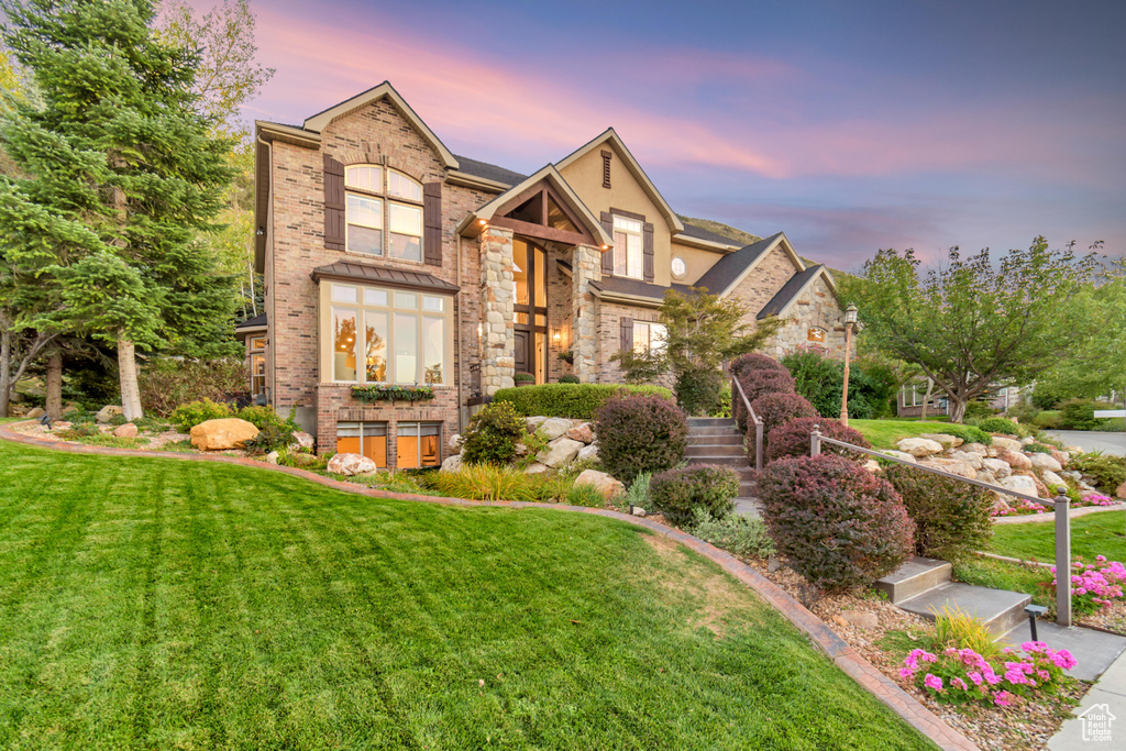 View of front of home with a yard